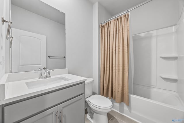 bathroom with toilet, tile patterned floors, shower / bath combo with shower curtain, and vanity