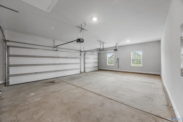 garage with recessed lighting, baseboards, and a garage door opener