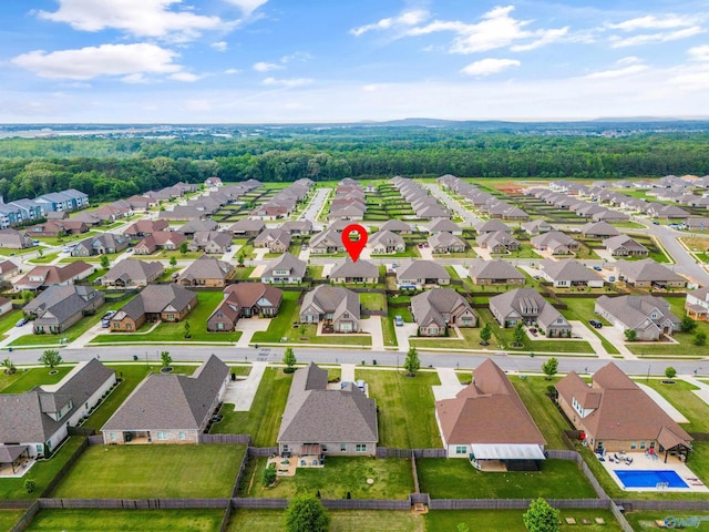 birds eye view of property with a residential view