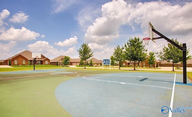 view of sport court featuring community basketball court and a residential view