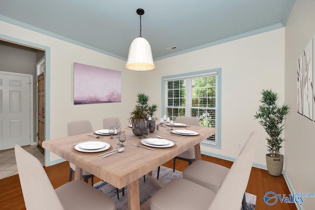 114 Canterbury Dr, Madison, AL 35758 - dining room featuring crown molding and wood finished floors