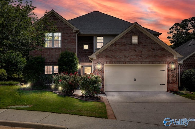 114 Canterbury Dr, Madison, AL 35758 - traditional home featuring concrete driveway, a garage, a yard, and brick siding