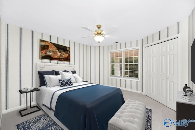 114 Canterbury Dr, Madison, AL 35758 - bedroom with wallpapered walls, a ceiling fan, a closet, and light carpet