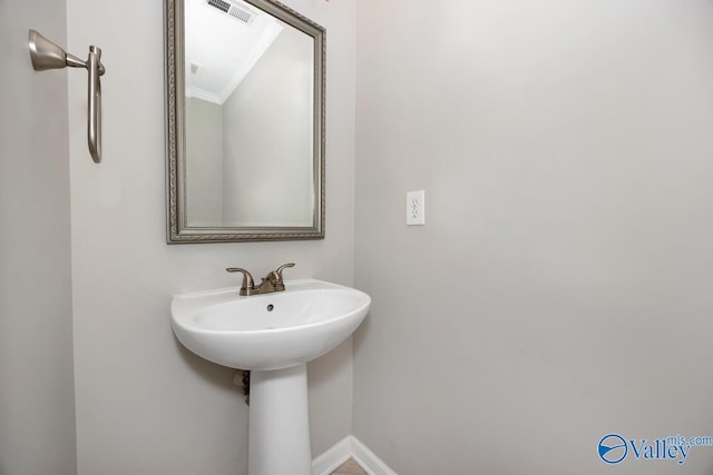 114 Canterbury Dr, Madison, AL 35758 - bathroom with crown molding and baseboards