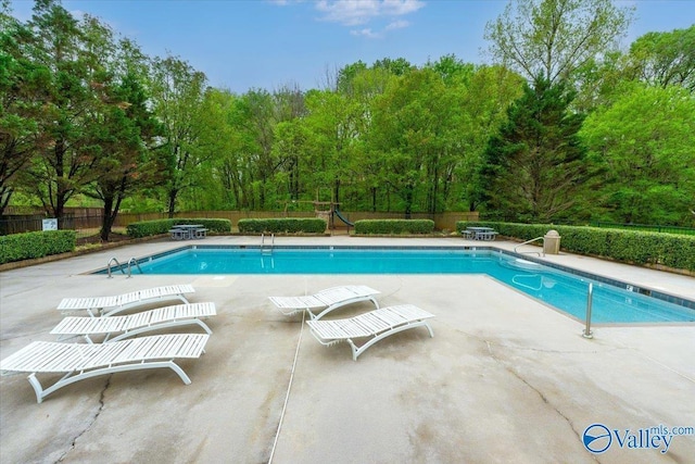 114 Canterbury Dr, Madison, AL 35758 - community pool featuring a patio area and a fenced backyard