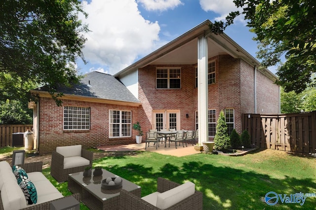 114 Canterbury Dr, Madison, AL 35758 - back of property featuring a patio, an outdoor hangout area, a fenced backyard, and brick siding