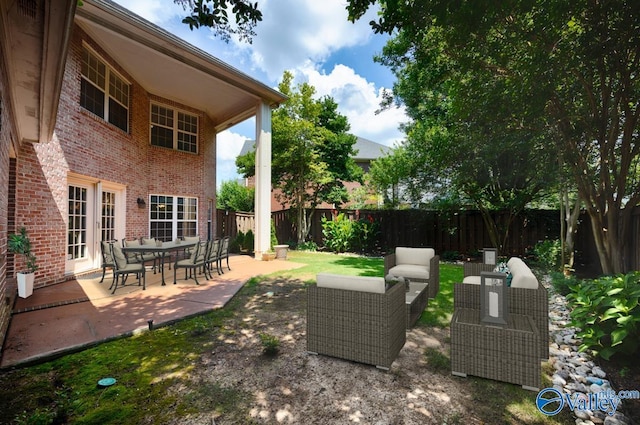 114 Canterbury Dr, Madison, AL 35758 - fenced backyard featuring an outdoor living space and a patio