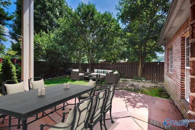114 Canterbury Dr, Madison, AL 35758 - fenced backyard with outdoor dining area, a patio area, and outdoor lounge area