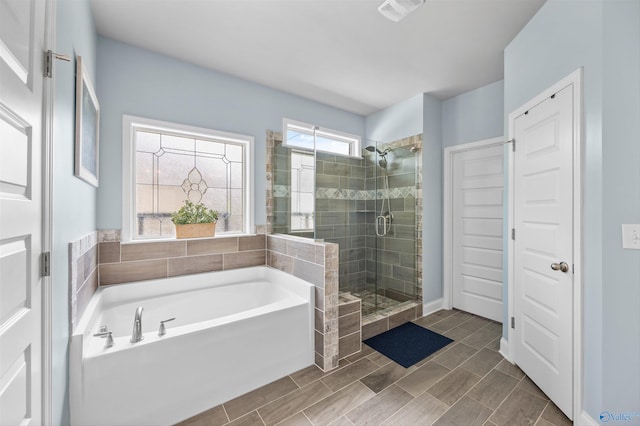 7417 Nature Walk Way SE, Owens Cross Roads, AL 35763 - bathroom with a bath and a stall shower