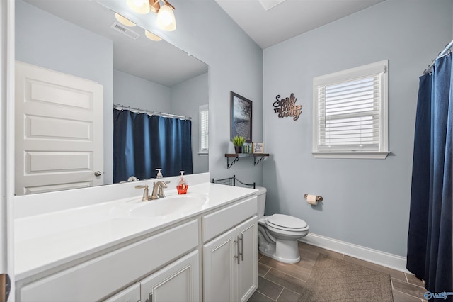 7417 Nature Walk Way SE, Owens Cross Roads, AL 35763 - bathroom with vanity, toilet, baseboards, wood tiled floors, and a shower with curtain