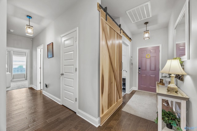 7417 Nature Walk Way SE, Owens Cross Roads, AL 35763 - entrance foyer with a barn door, dark wood-style floors, and baseboards