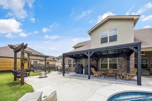 7417 Nature Walk Way SE, Owens Cross Roads, AL 35763 - back of property with an outdoor fire pit, a gazebo, brick siding, a patio, and a shingled roof
