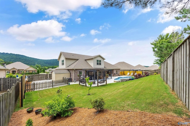 7417 Nature Walk Way SE, Owens Cross Roads, AL 35763 - back of house with brick siding, a patio area, and a mountain view
