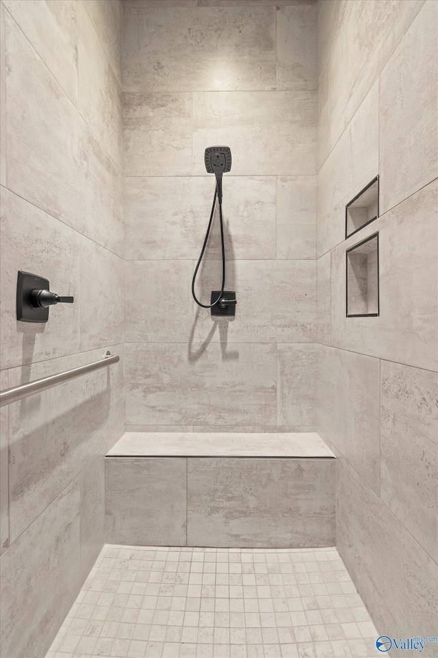 bathroom with tiled shower