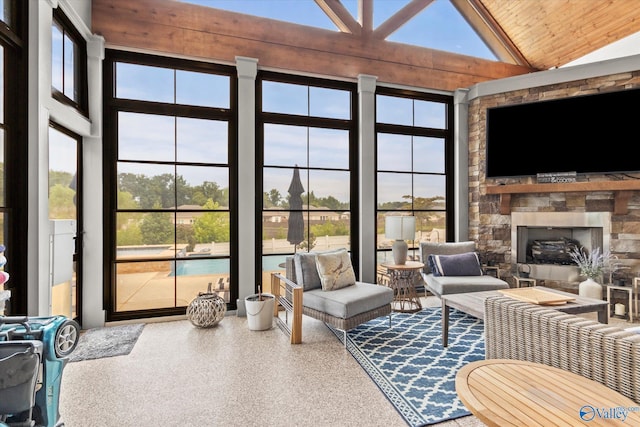 sunroom / solarium featuring plenty of natural light and vaulted ceiling