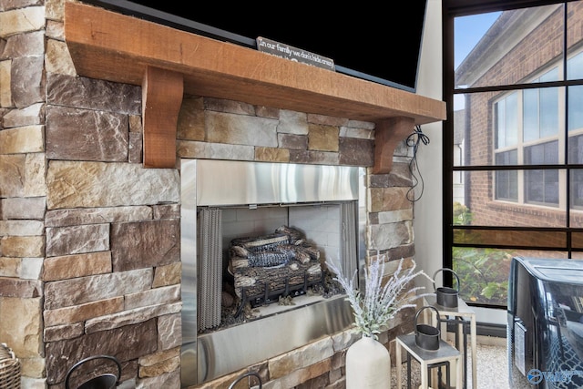 room details featuring a stone fireplace