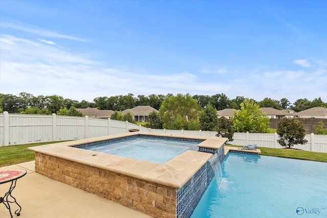 view of swimming pool with pool water feature and an in ground hot tub