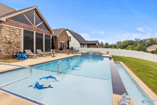 view of swimming pool featuring a patio area and a yard