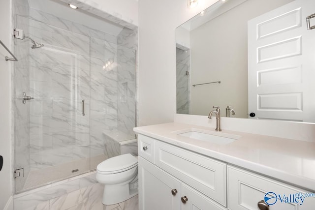 bathroom with a shower with door, vanity, and toilet