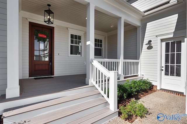 doorway to property featuring a porch