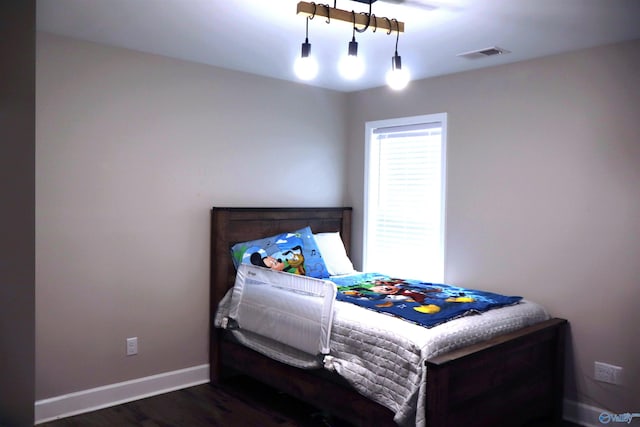 bedroom featuring dark hardwood / wood-style flooring