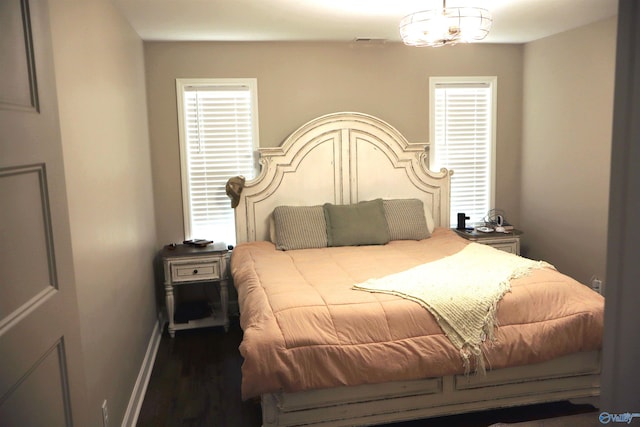 bedroom with dark wood-type flooring