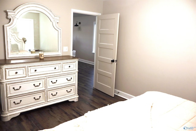 bedroom featuring dark wood-type flooring