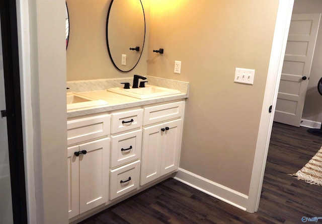 bathroom featuring vanity and hardwood / wood-style floors