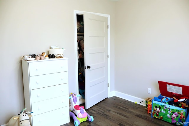 playroom with dark hardwood / wood-style flooring