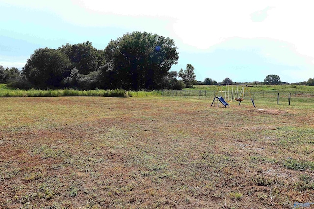 view of yard featuring a playground and a rural view