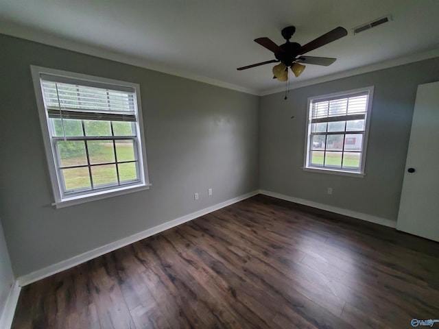 unfurnished room with dark hardwood / wood-style flooring, ceiling fan, and crown molding