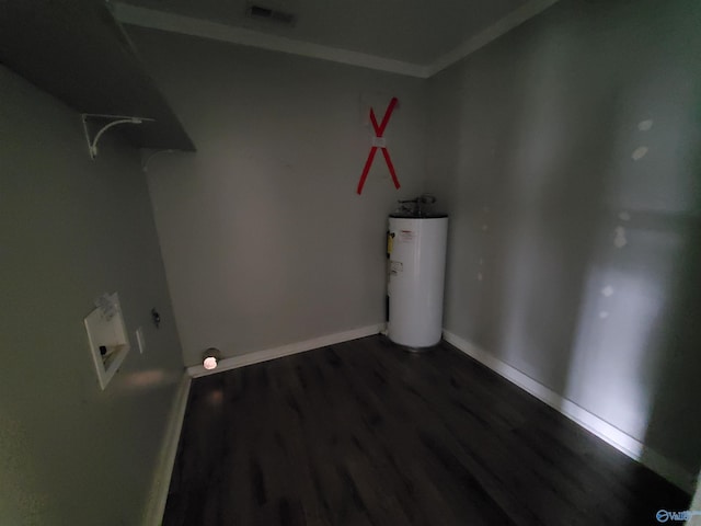 washroom featuring water heater and dark wood-type flooring