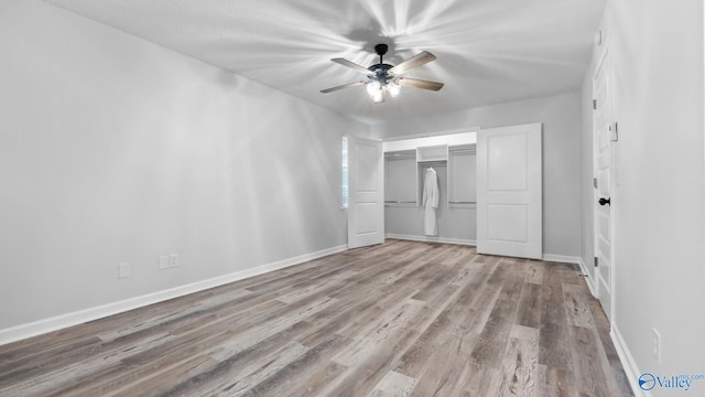 2055 Big Nose Dr, Centre, AL 35960 - unfurnished bedroom featuring wood finished floors, a closet, baseboards, and ceiling fan