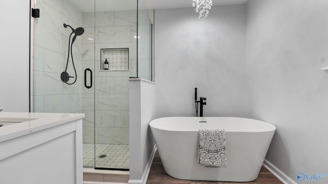 2055 Big Nose Dr, Centre, AL 35960 - bathroom with a freestanding bath, a shower stall, baseboards, and vanity