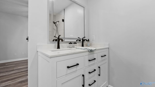 2055 Big Nose Dr, Centre, AL 35960 - bathroom with vanity, baseboards, wood finished floors, and a shower