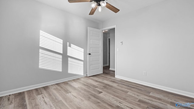 2055 Big Nose Dr, Centre, AL 35960 - empty room with a ceiling fan, wood finished floors, and baseboards