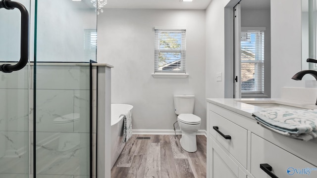 2055 Big Nose Dr, Centre, AL 35960 - full bath featuring vanity, wood finished floors, baseboards, toilet, and a shower with door