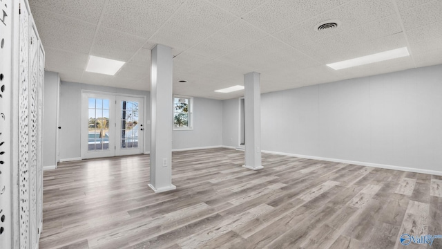 2055 Big Nose Dr, Centre, AL 35960 - basement featuring a paneled ceiling, wood finished floors, and baseboards
