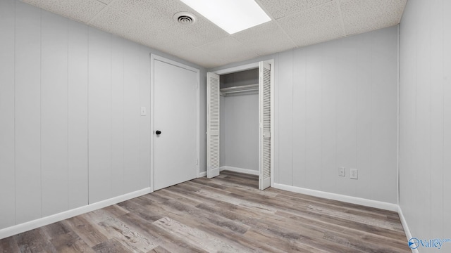 2055 Big Nose Dr, Centre, AL 35960 - unfurnished bedroom with wood finished floors, a closet, and a drop ceiling