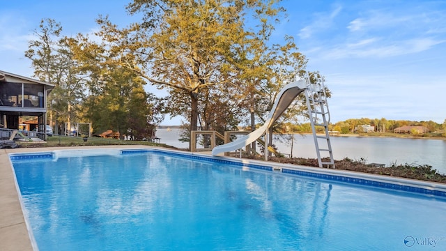 view of swimming pool with a water view and a water slide