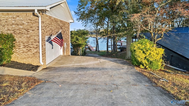 2055 Big Nose Dr, Centre, AL 35960 - view of property exterior with brick siding, concrete driveway, and a garage