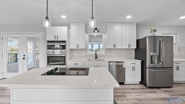 2055 Big Nose Dr, Centre, AL 35960 - kitchen featuring stainless steel appliances, a sink, white cabinetry, tasteful backsplash, and recessed lighting