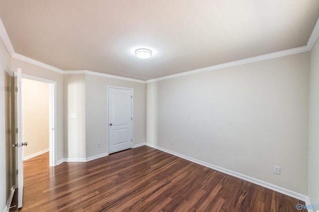 unfurnished bedroom featuring crown molding and dark hardwood / wood-style flooring