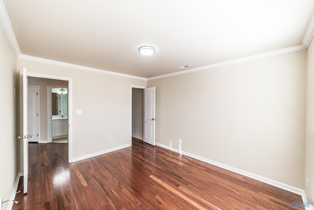 unfurnished room with dark wood-type flooring and ornamental molding