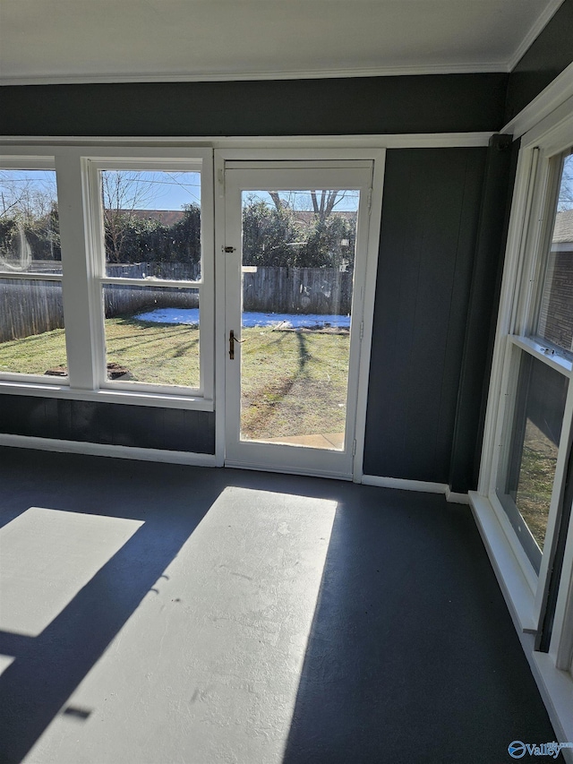 doorway to outside with crown molding