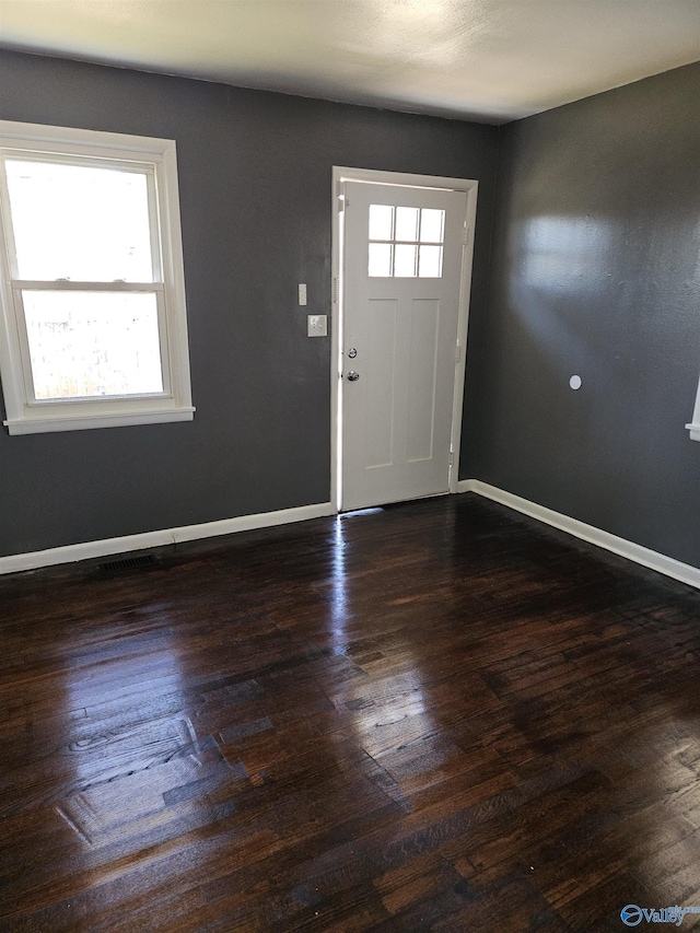 foyer with dark hardwood / wood-style flooring