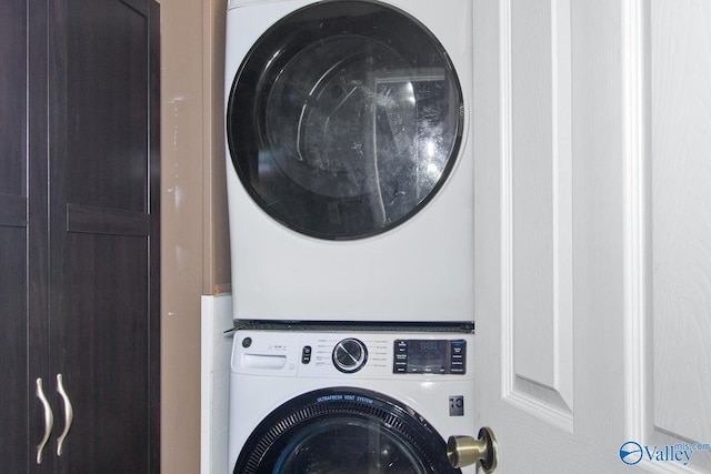 laundry area with laundry area and stacked washer and clothes dryer