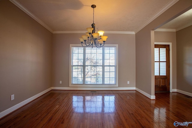 unfurnished room featuring a notable chandelier, dark wood-type flooring, and ornamental molding