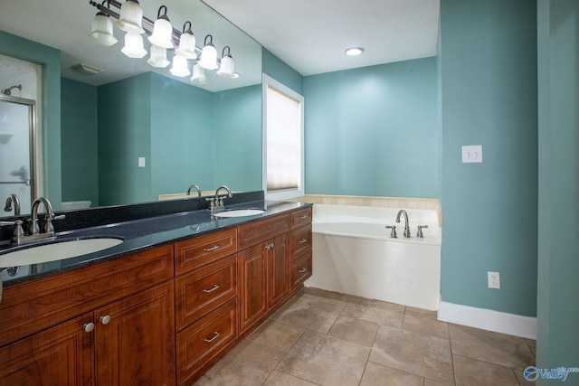 bathroom with vanity, tile patterned flooring, and plus walk in shower