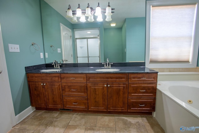 bathroom with vanity, tile patterned floors, and separate shower and tub